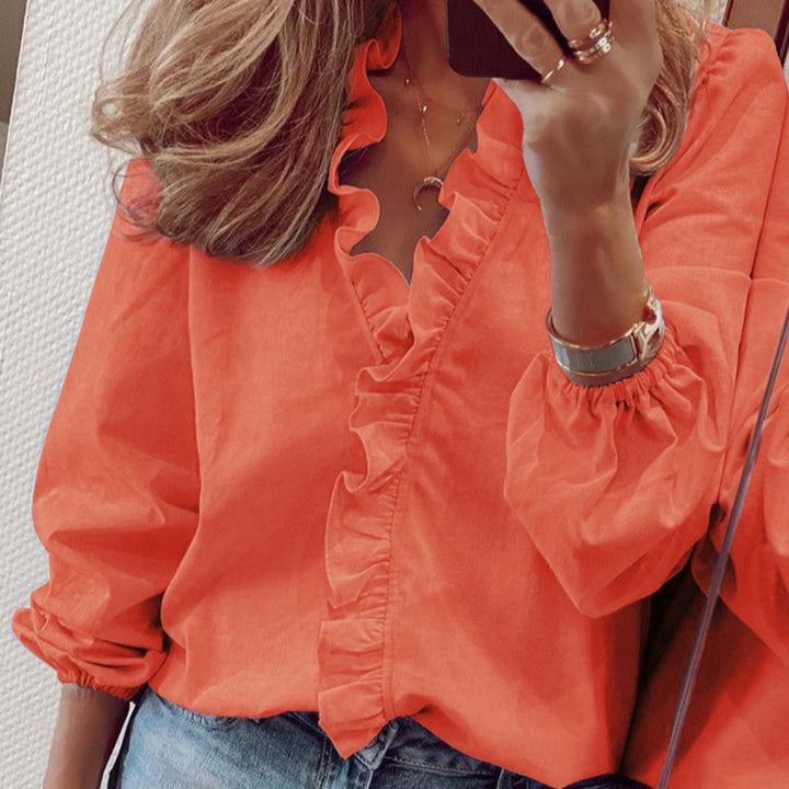 Blouse met blauwe ruches en pofmouwen