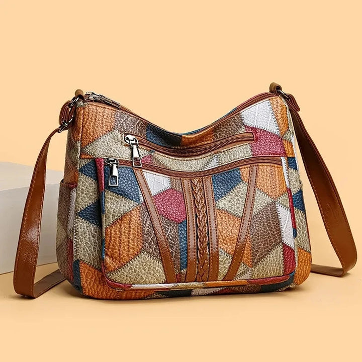 Patchwork-tas voor elke dag met inzetstukken van kunstleer.