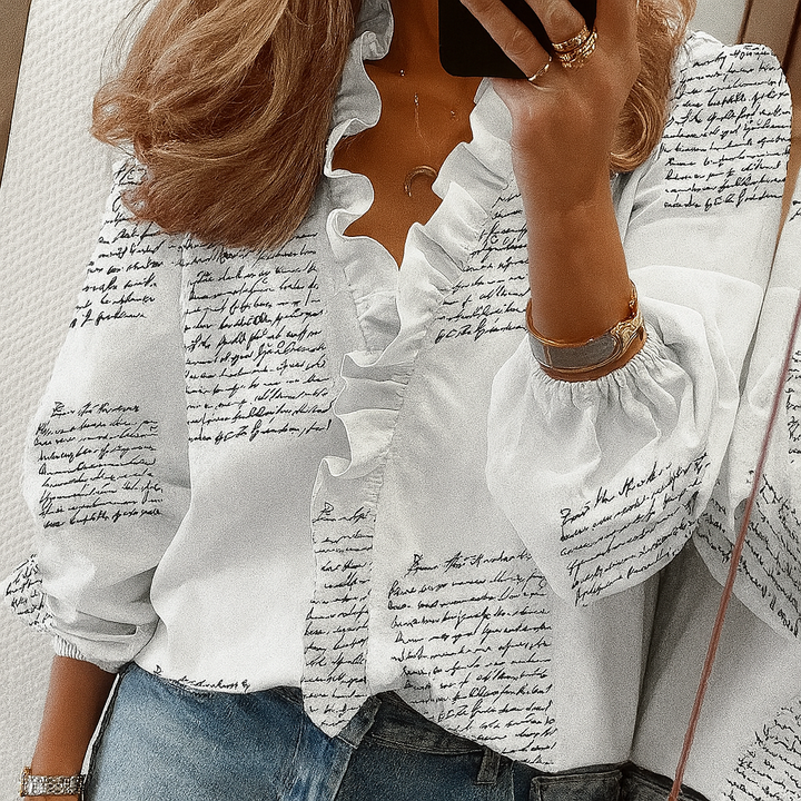 Blouse met blauwe ruches en pofmouwen