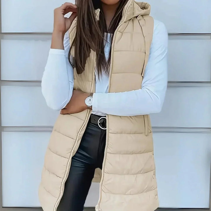 Lange mouwloze puffer gilet met capuchon