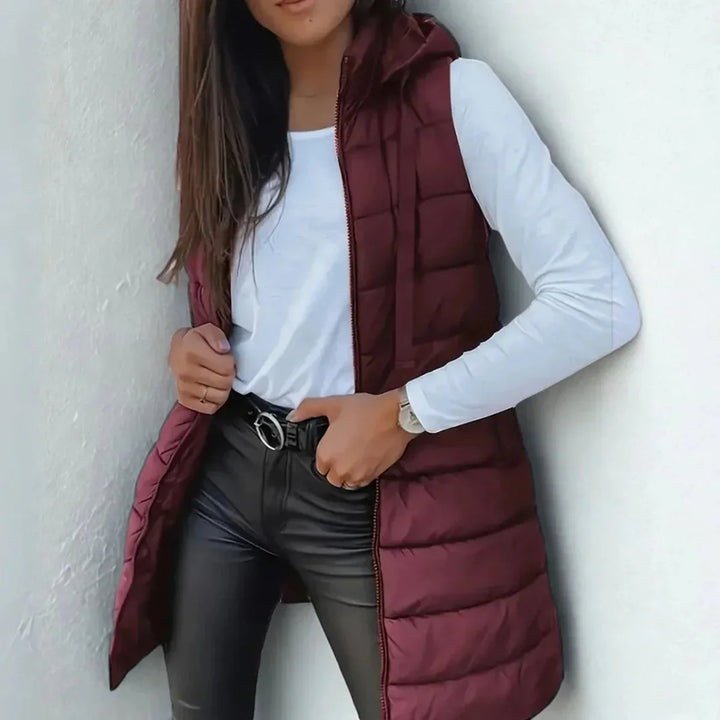 Lange mouwloze puffer gilet met capuchon