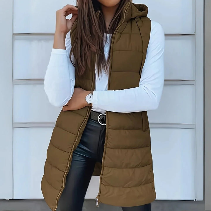 Lange mouwloze puffer gilet met capuchon
