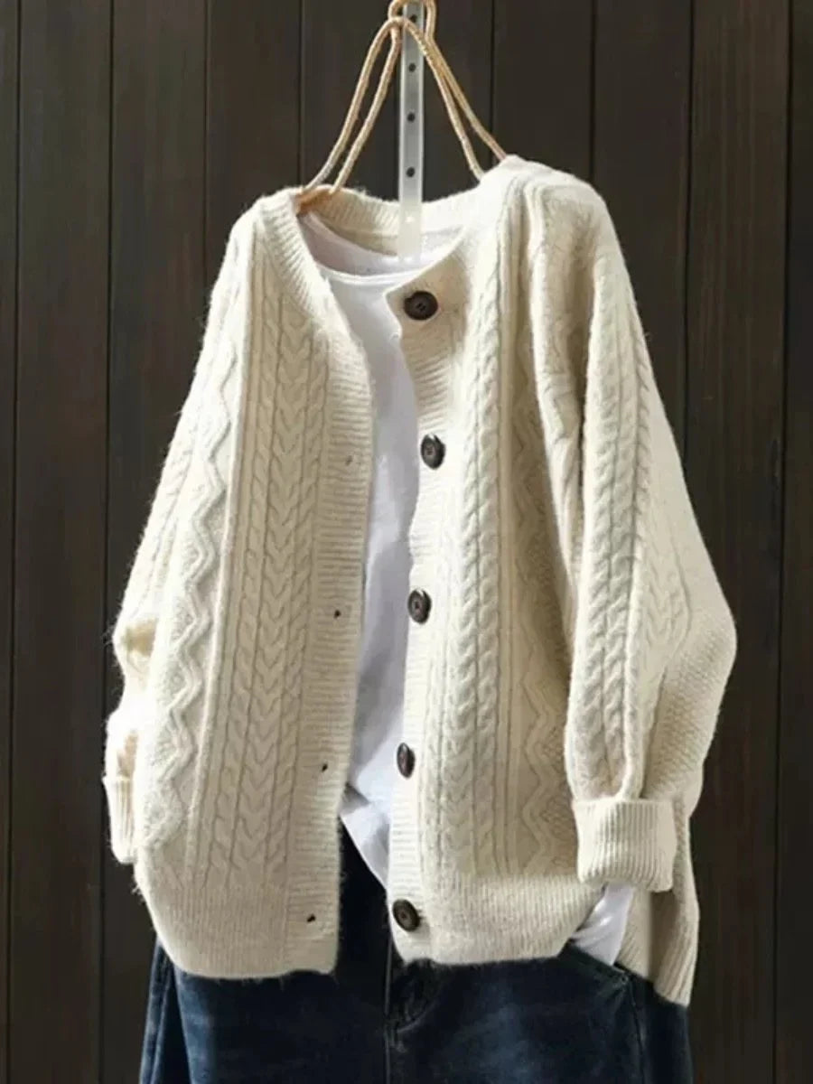 Oversized kabelbreivest met knopen